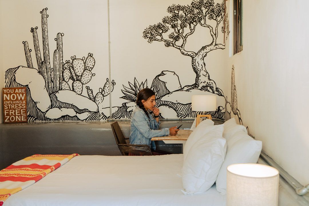 Bedroom with hand-painted mural