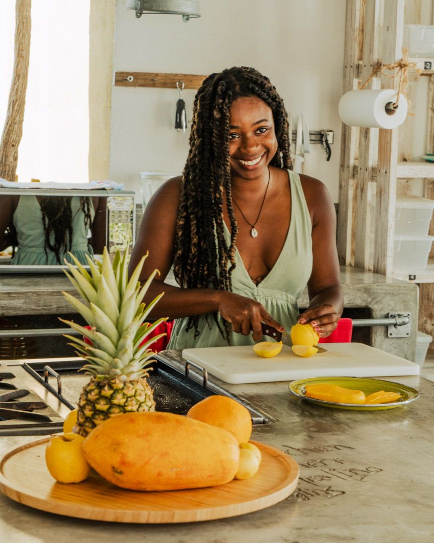 Member preparing fresh fruit in the shared kitchen