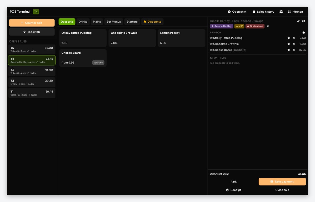 POS terminal with a customer attached to a tab, showing VIP and dietary chips