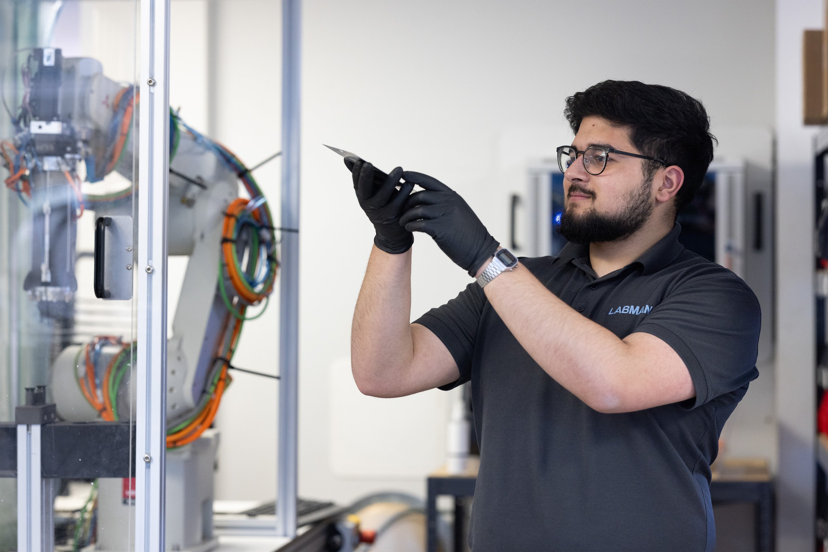 A Labman intern testing lab equipment
