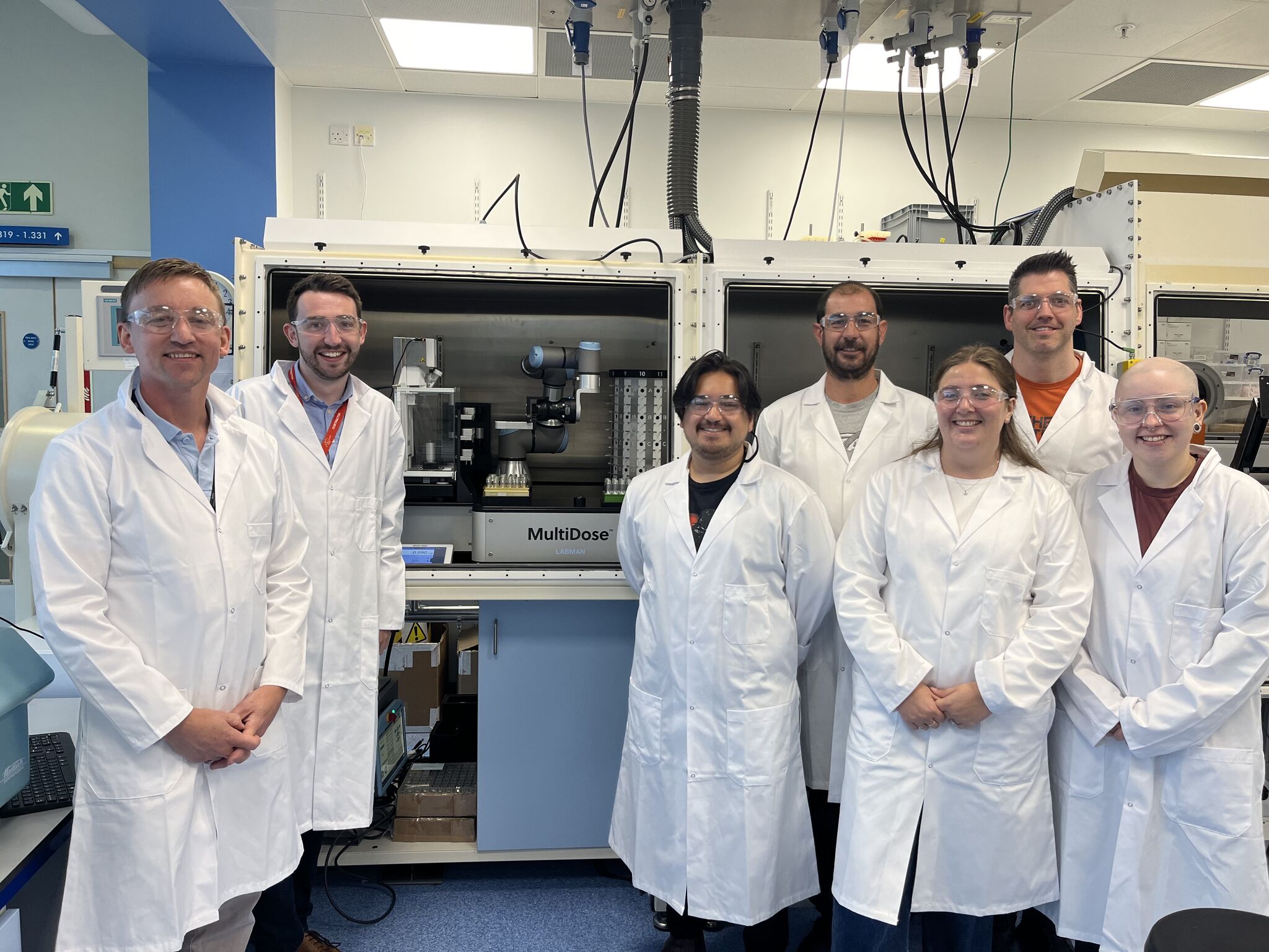 Lab technicians with a laboratory fume cupboard