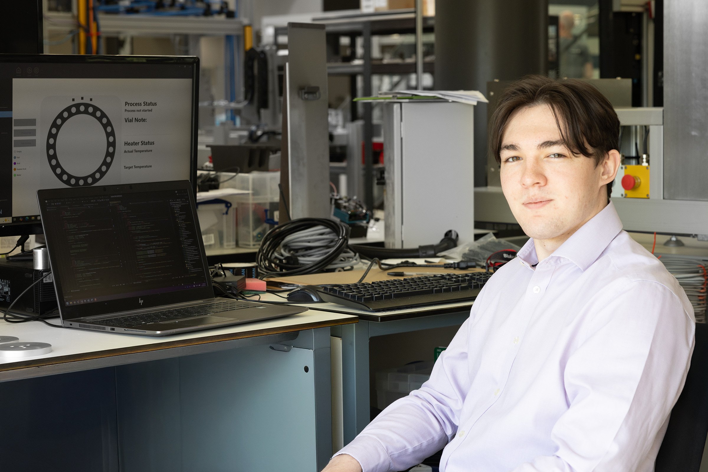 ALabman intern next to a laptop