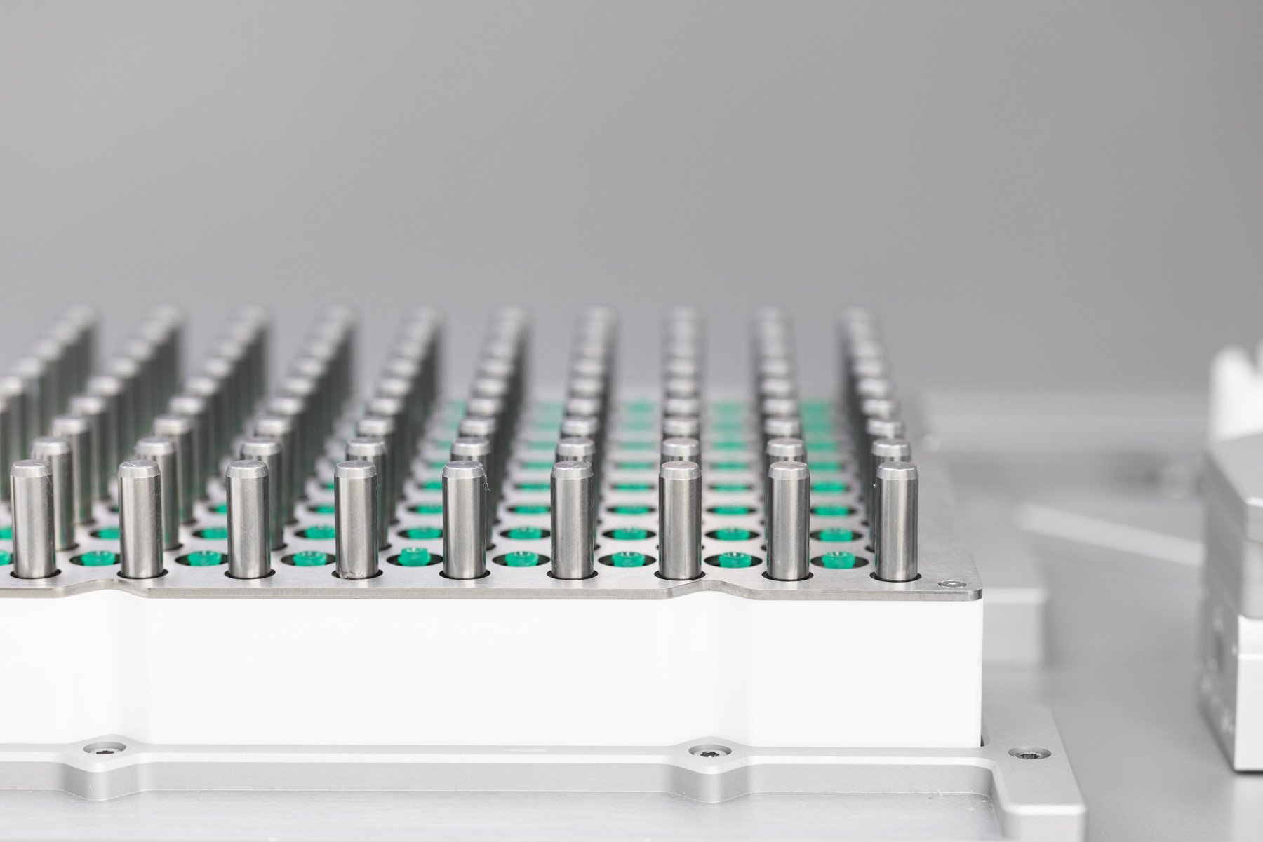 Rows of syringe tips in a rack on a formulation system