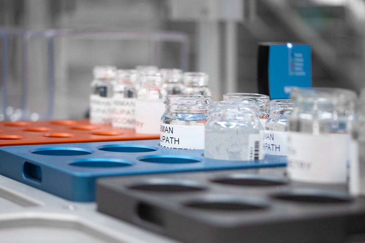 Sample jars being stored in different size racks