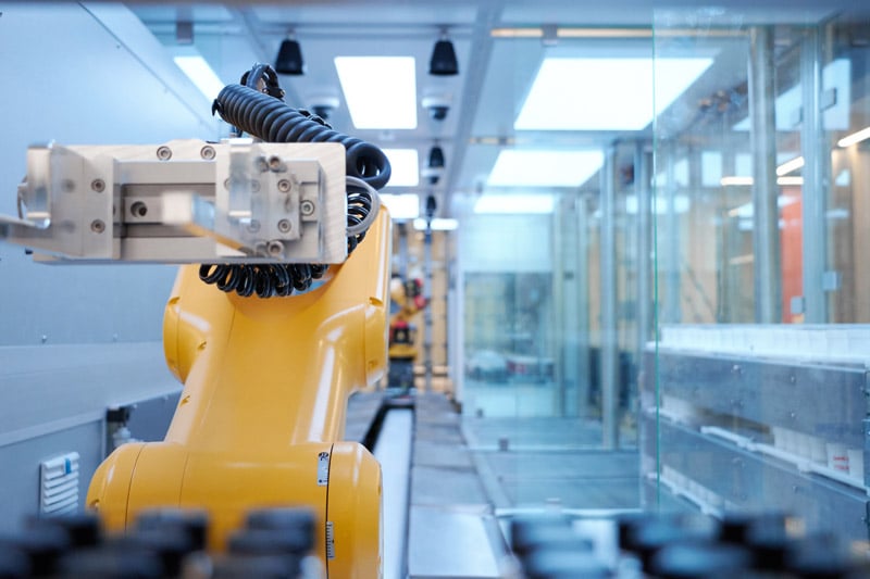 Yellow robot arm in formulation engine