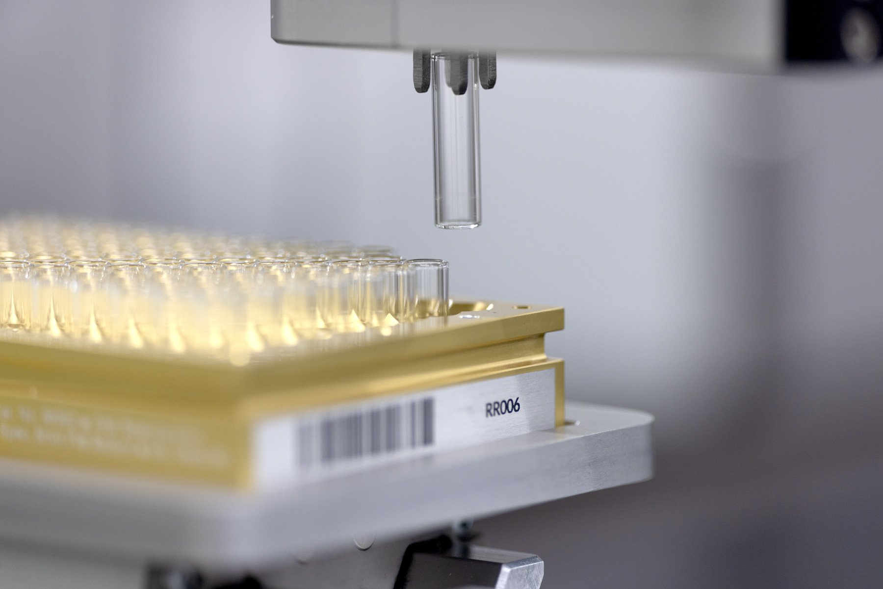 Robot gripper holding a vial