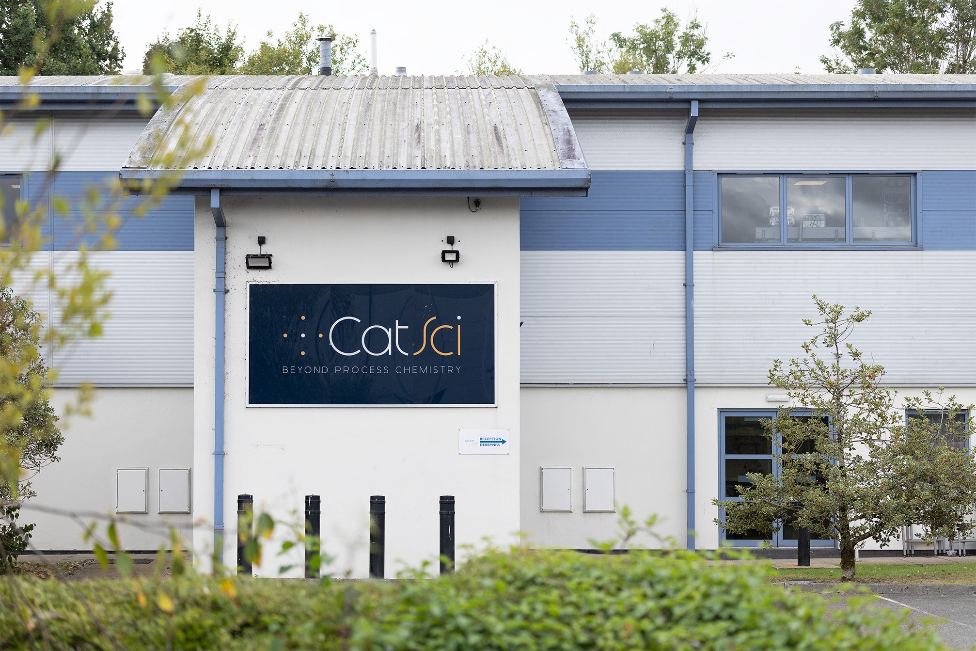A large office and lab building with a large CatSci sign