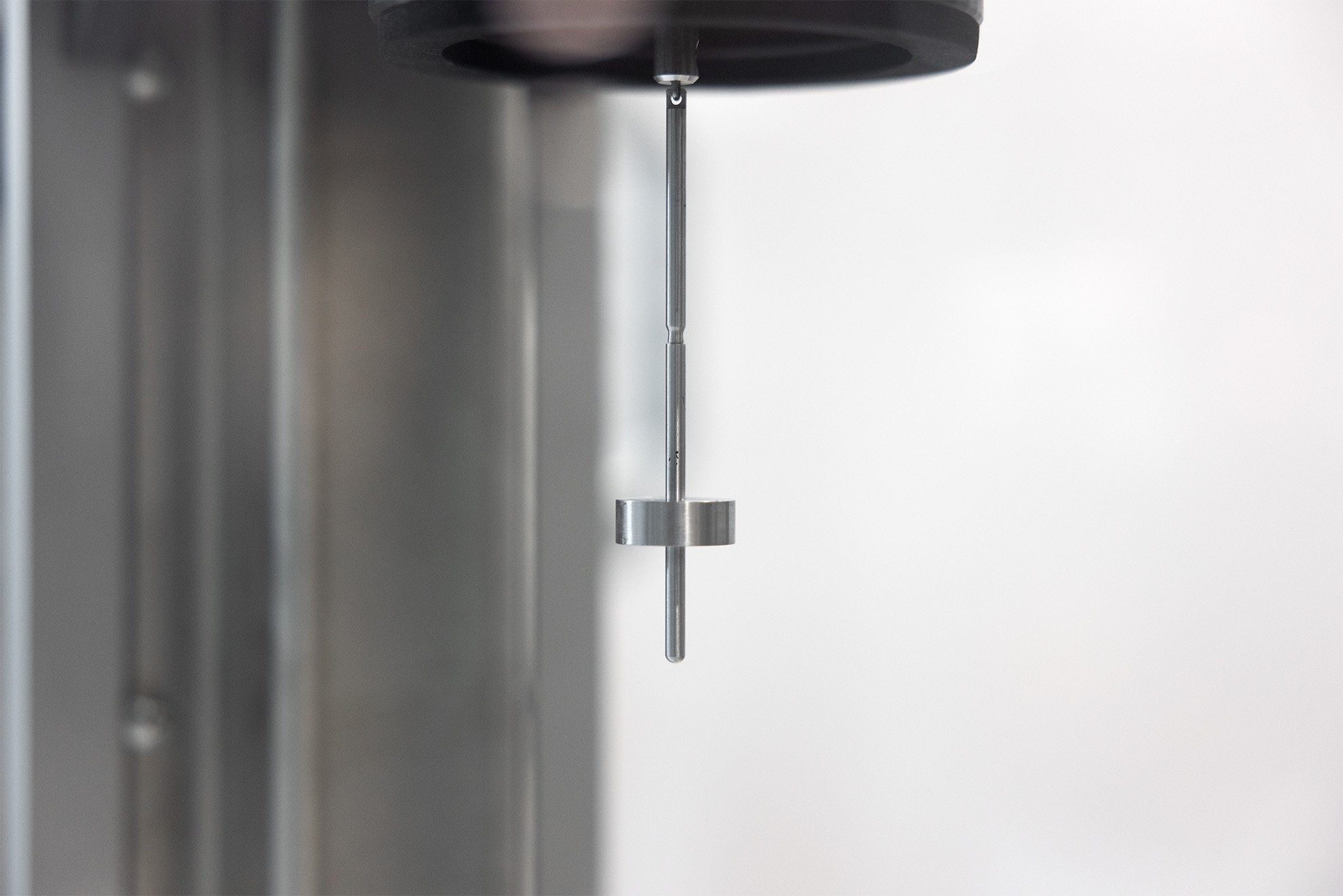 A geometry used for taking viscometry measurements suspended on a robotic system