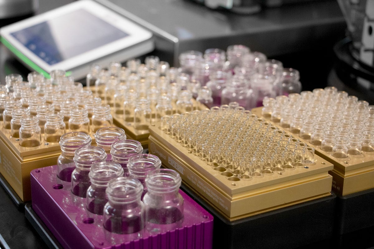 SBS format vial racks filled with different sized glass vials