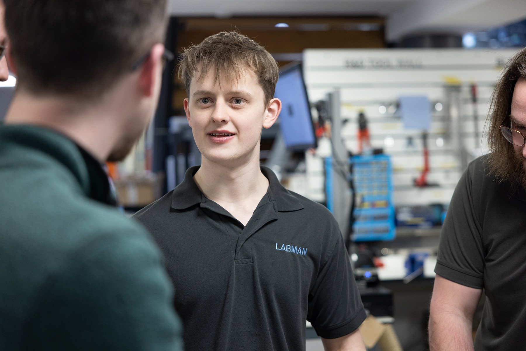 Labman's intern Ewan talking to colleagues and friends during his engineering placement