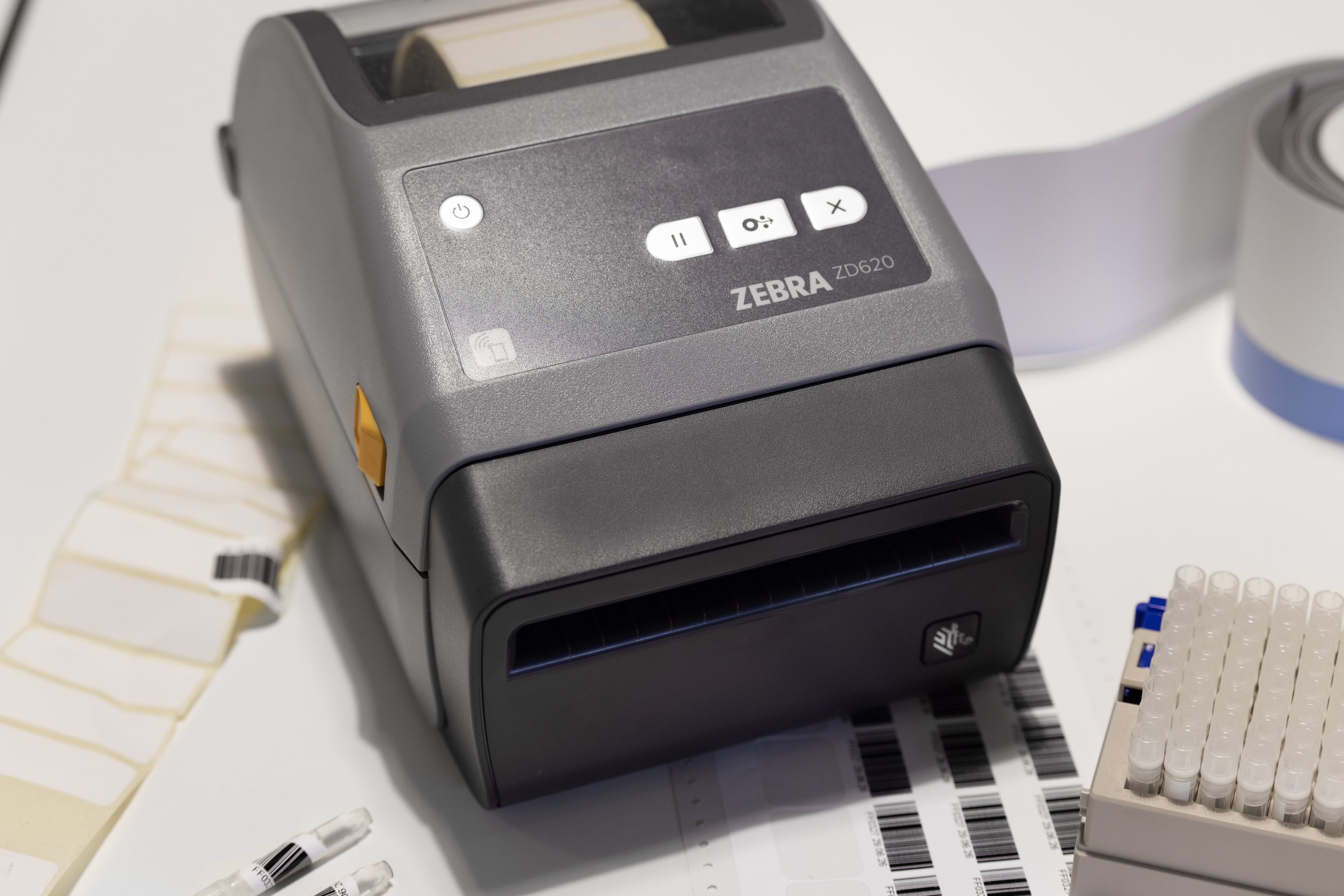 Zebra label printer with tubes and label sheets in a lab environment