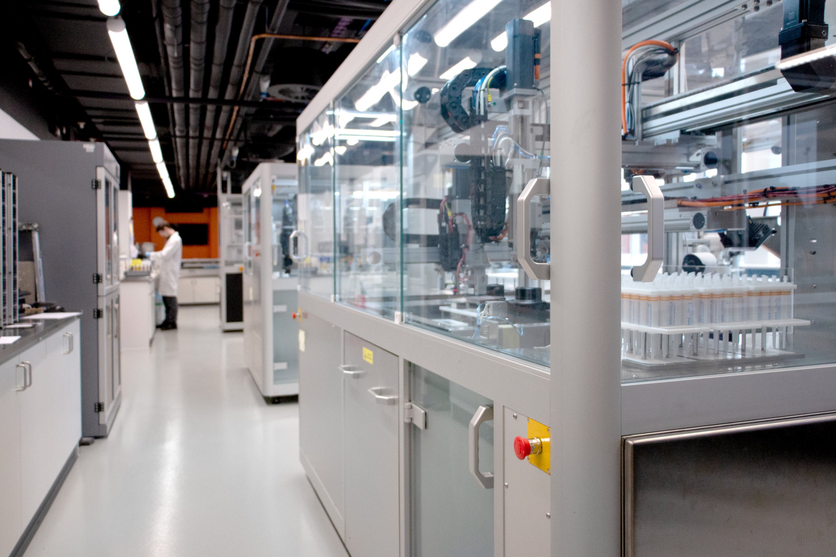 A row of paint formulation robots in a lab