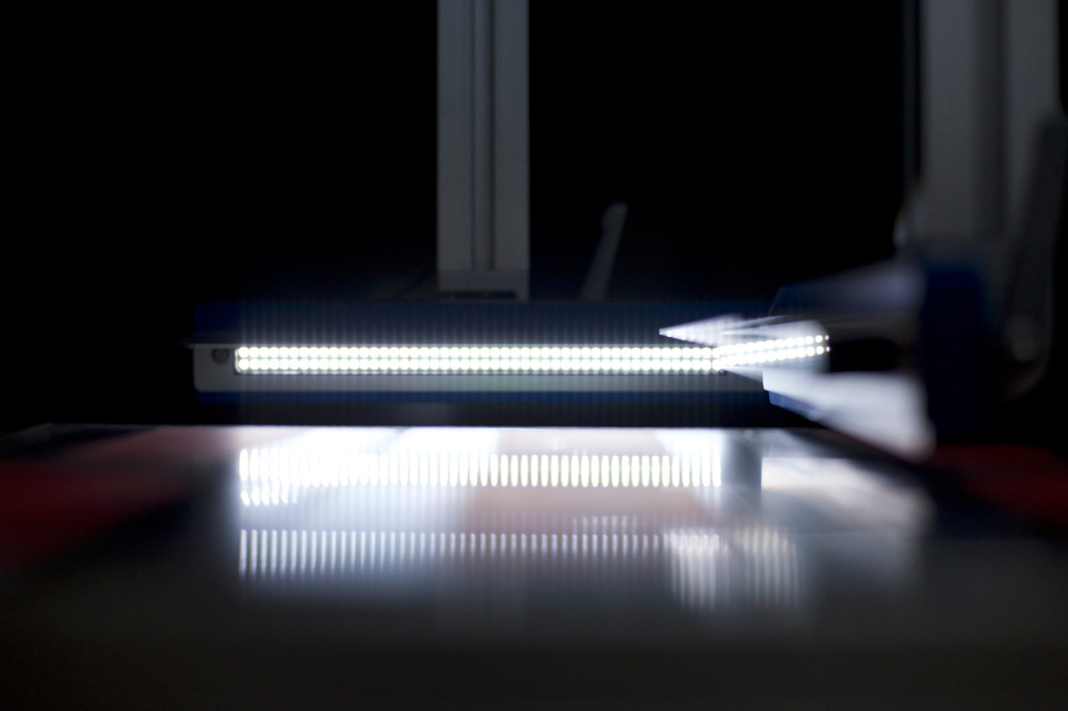 A scientific light reflecting on a shiny surface