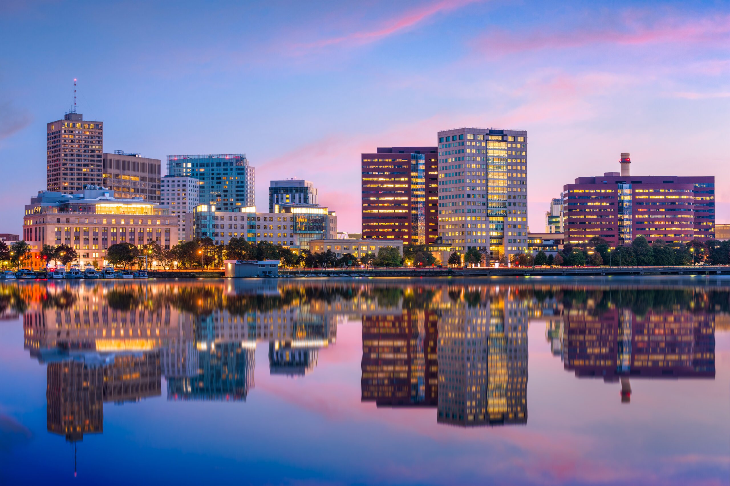 City skyline at sunset with reflection on the water