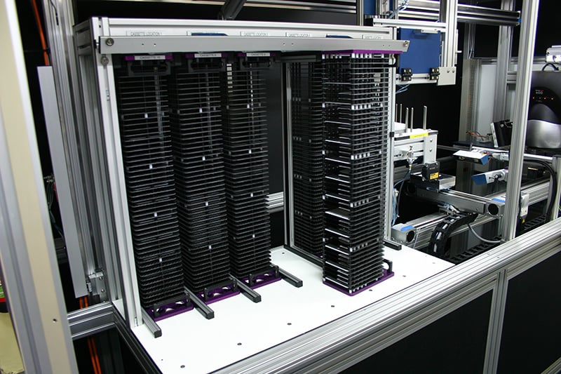A labman custom robotic system containing lots of racks in a row