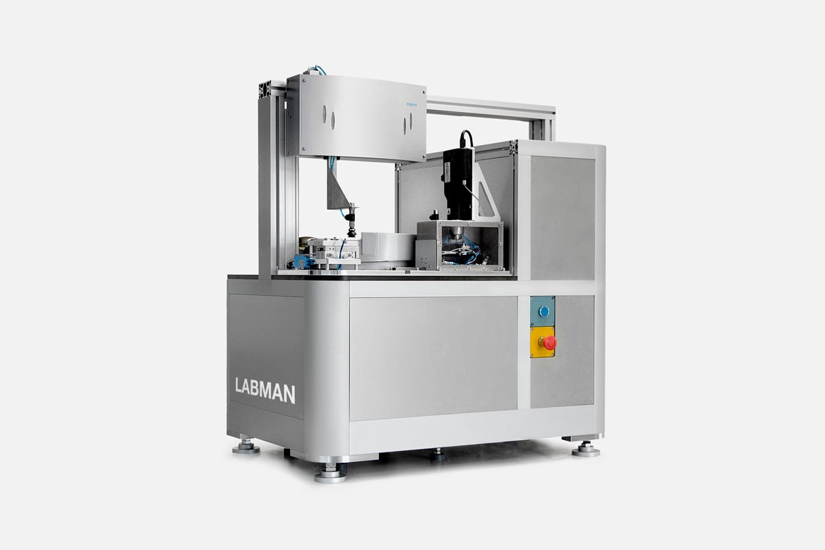 A silver labman custom robotic system on a white background