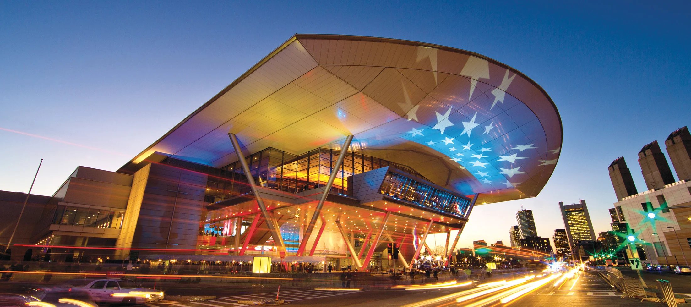 Time lapse outside a curved conference building with stars on the roof