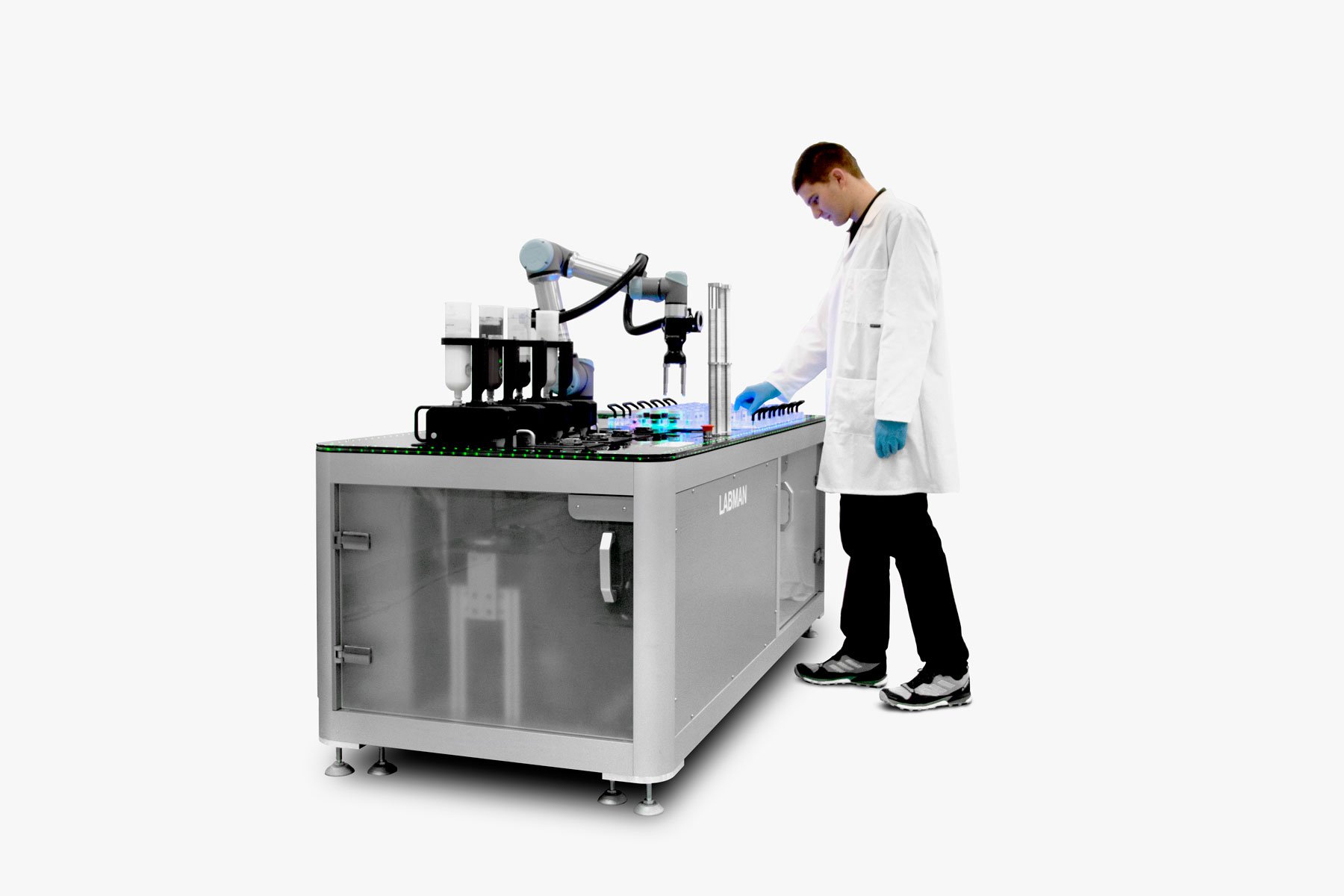 Man wearing lab coat and blue gloves standing at collaborative formulator loading vials into the rack