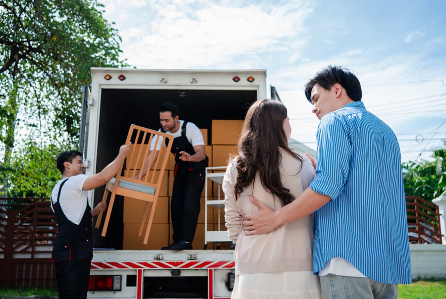Packing Services 4 OverEasyMovers team unloading furniture for a couple during their move to Alhambra.