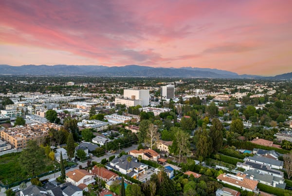 Aerial view of Anaheim neighborhoods during sunset, showcasing residential areas perfect for local moving in Anaheim with OverEasyMovers.