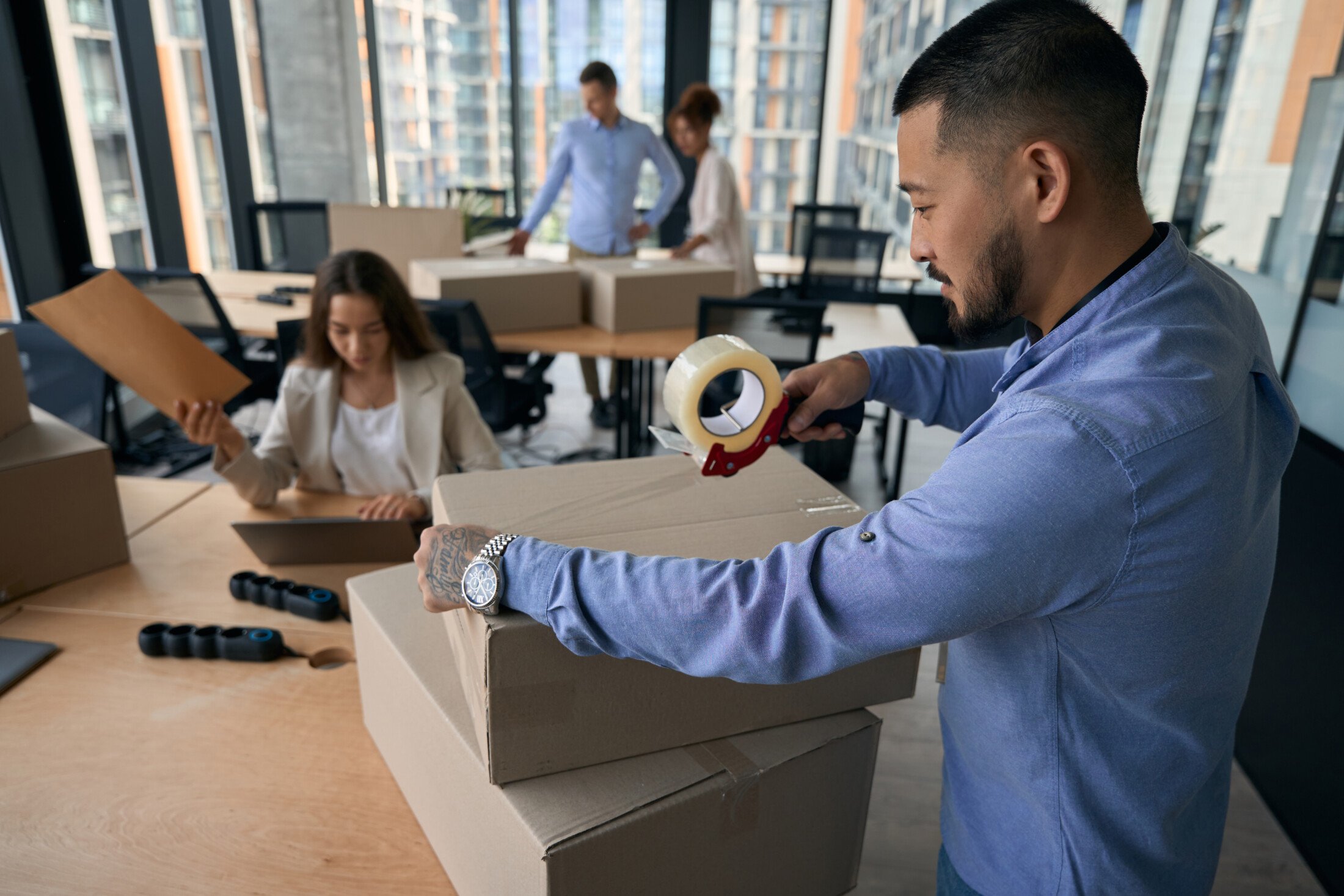 Efficient Business Moving Anaheim | OverEasyMovers Services 1 Business moving Anaheim with OverEasyMovers team packing office equipment.