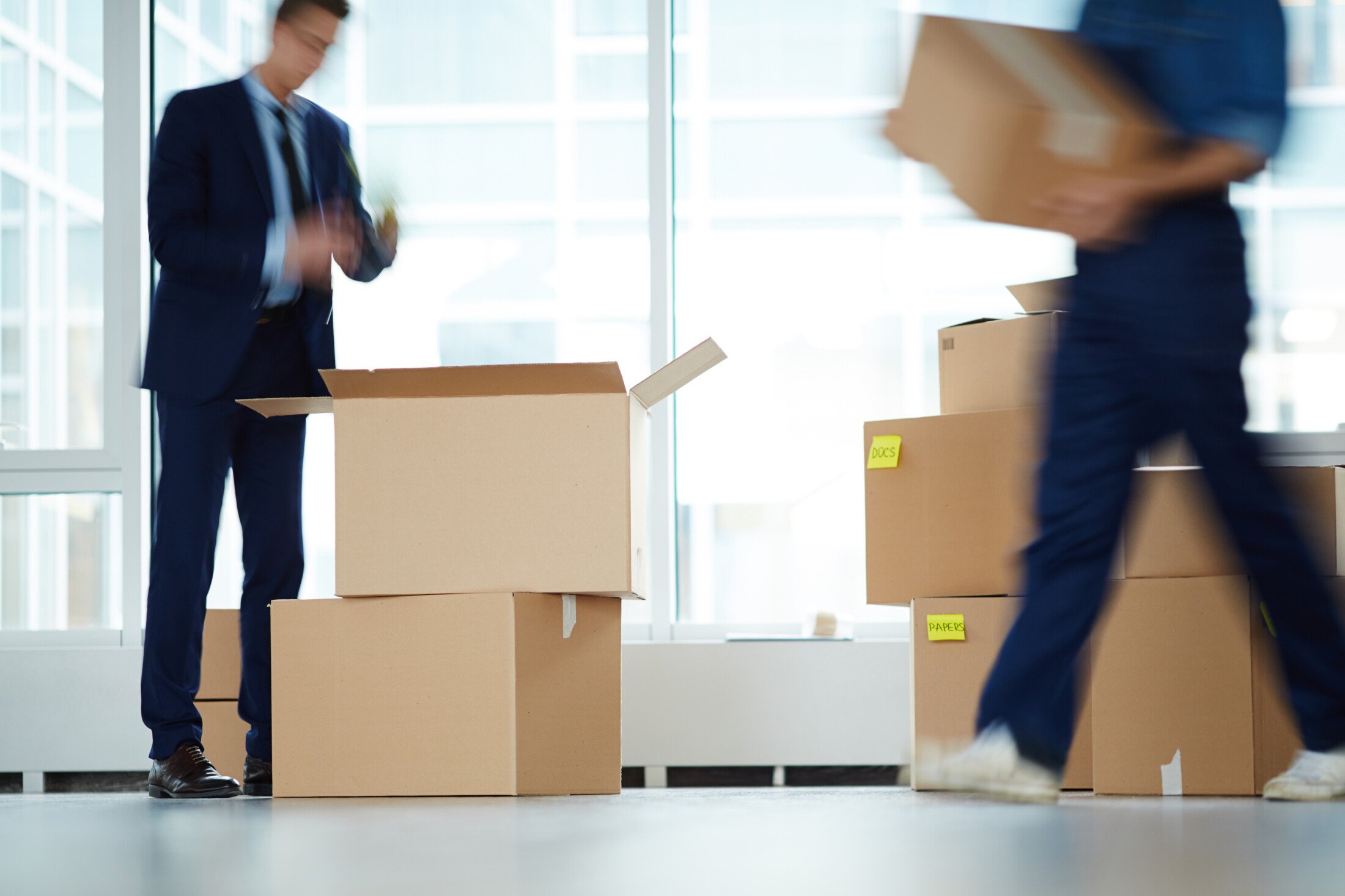 Efficient Business Moving Anaheim | OverEasyMovers Services 2 Business moving Anaheim with OverEasyMovers team packing office boxes.
