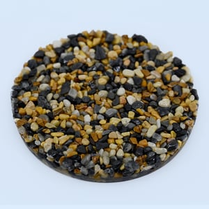 Coral Gravel pebble epoxy blend sample featuring coral, beige, and ivory river stones for driveways and patios