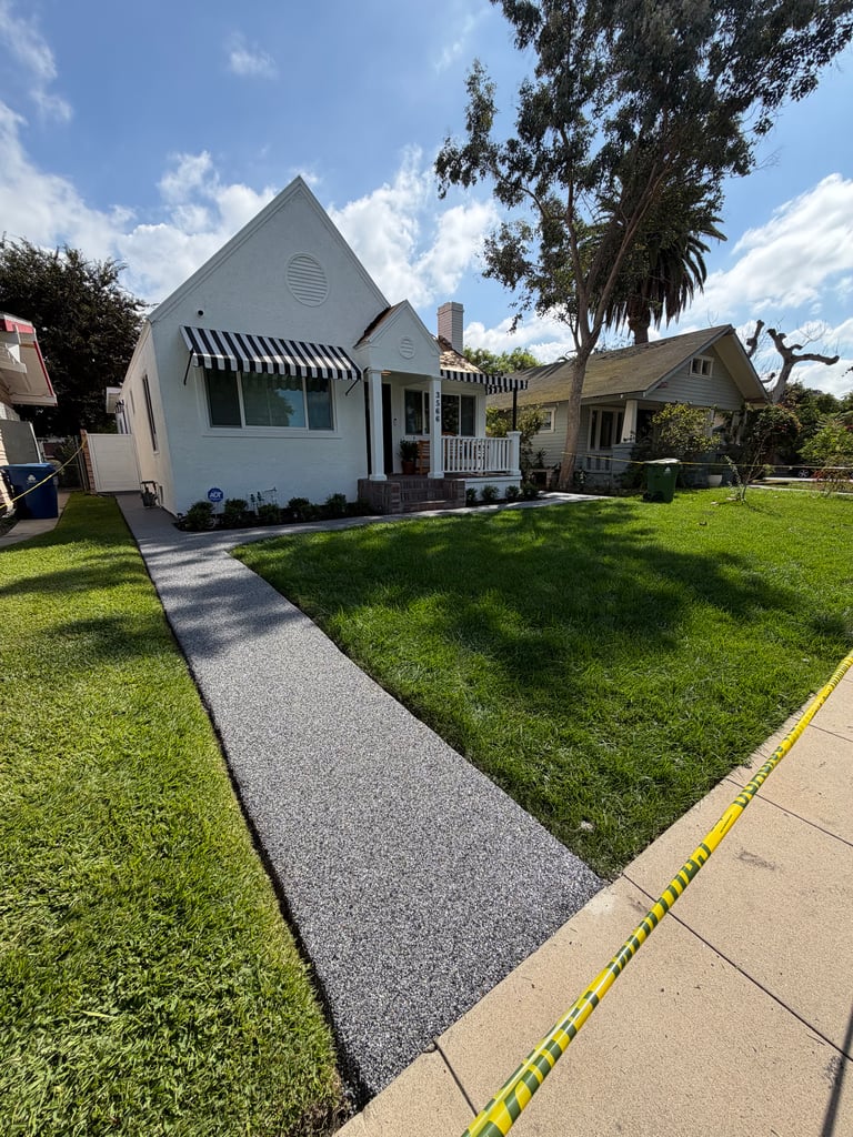 IMG_8527 Pebble epoxy stone carpet pathway with natural river stones, slip-resistant and decorative outdoor resurfacing in Southern California.
