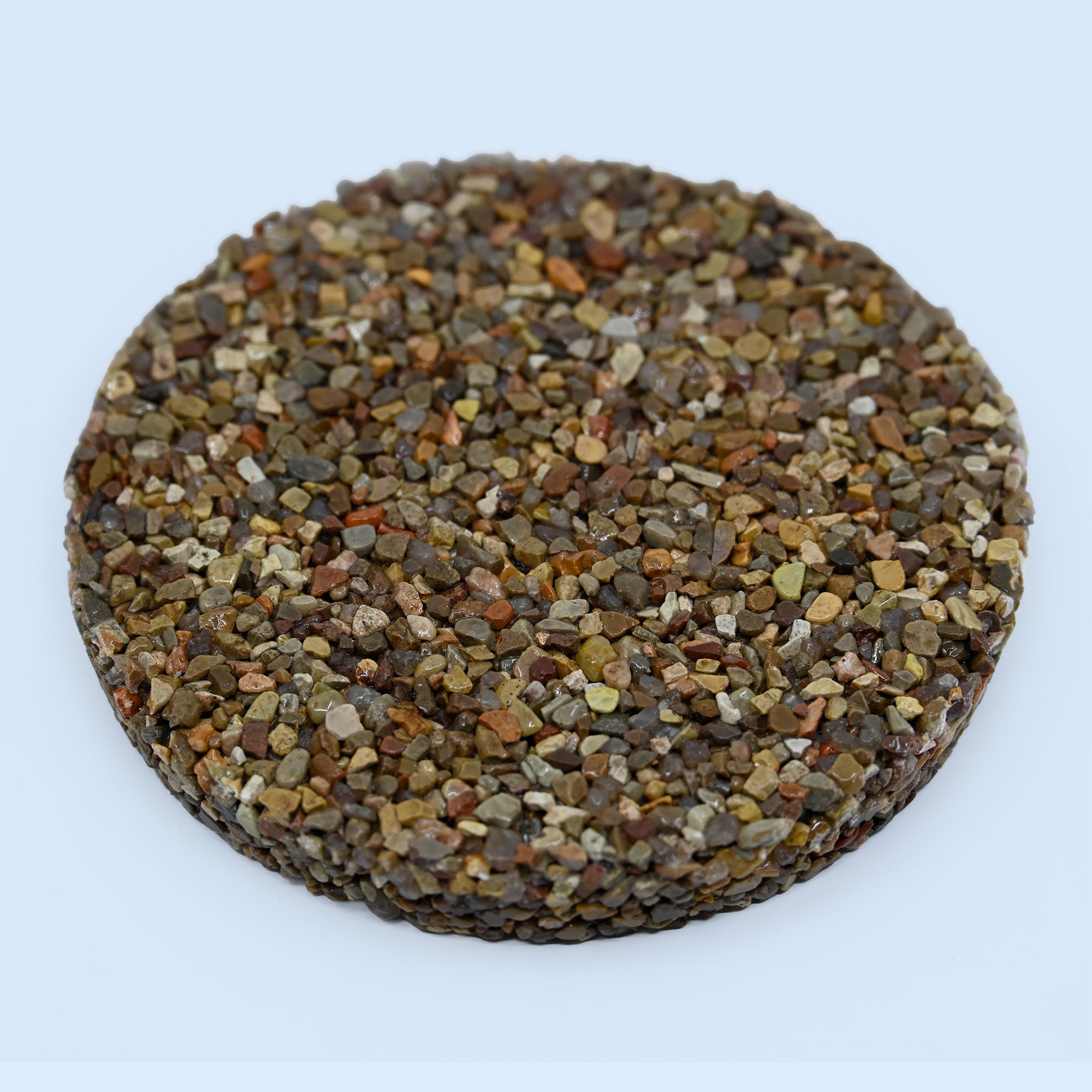 Razor Black Red pebble epoxy sample — deep black and crimson river stones in high-gloss epoxy resin.