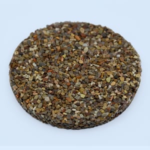 Razor Black Red pebble epoxy sample — deep black and crimson river stones in high-gloss epoxy resin.