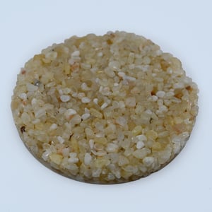 White Jade pebble epoxy sample showing polished white and ivory river stones bound with clear UV-stable resin.