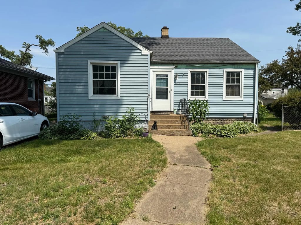 Front view of a home sold to Spectrum Property Solutions to help the homeowner avoid foreclosure.