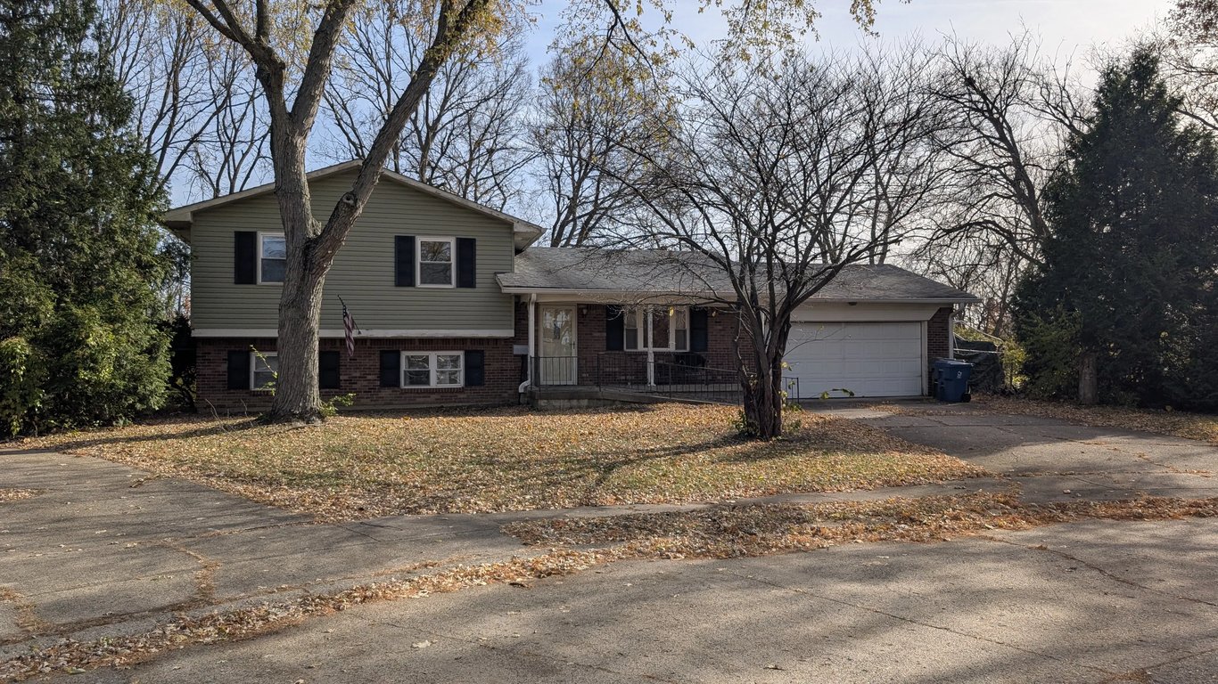 Inherited 1980s Cincinnati brick and siding home with a wheelchair ramp and heavily dated interior purchased as-is.