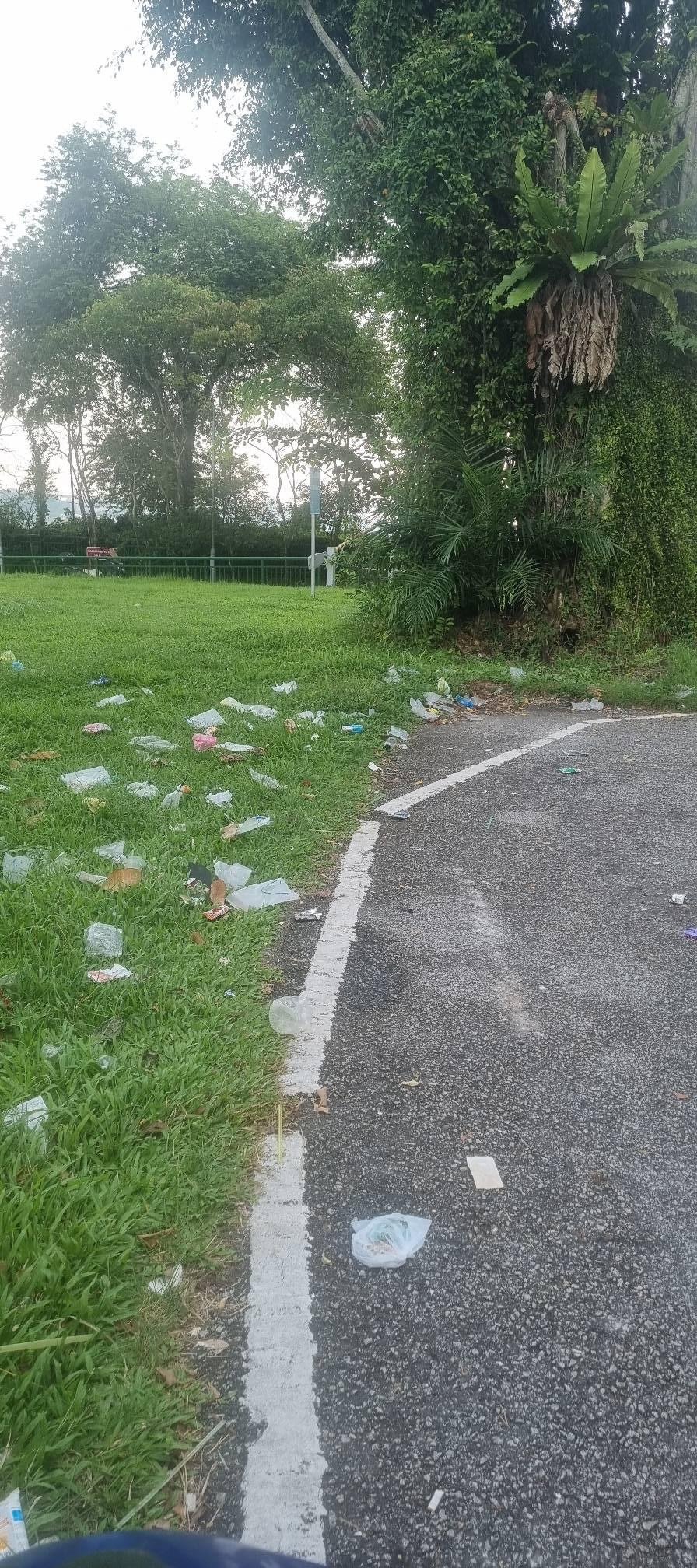 motorcyclist at littered spot in Singapore
