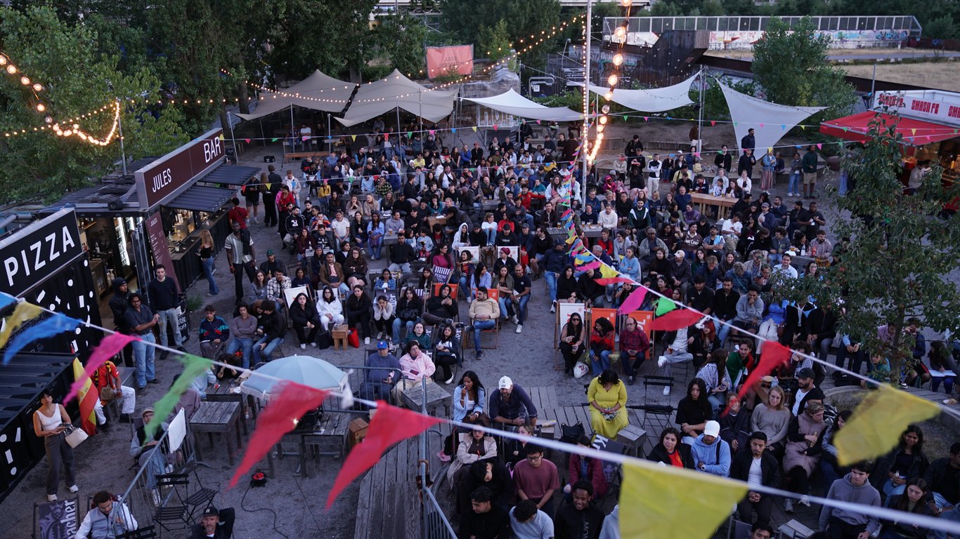 Overhead view of a packed Jules B-Part courtyard at dusk during Diwali in Berlin
