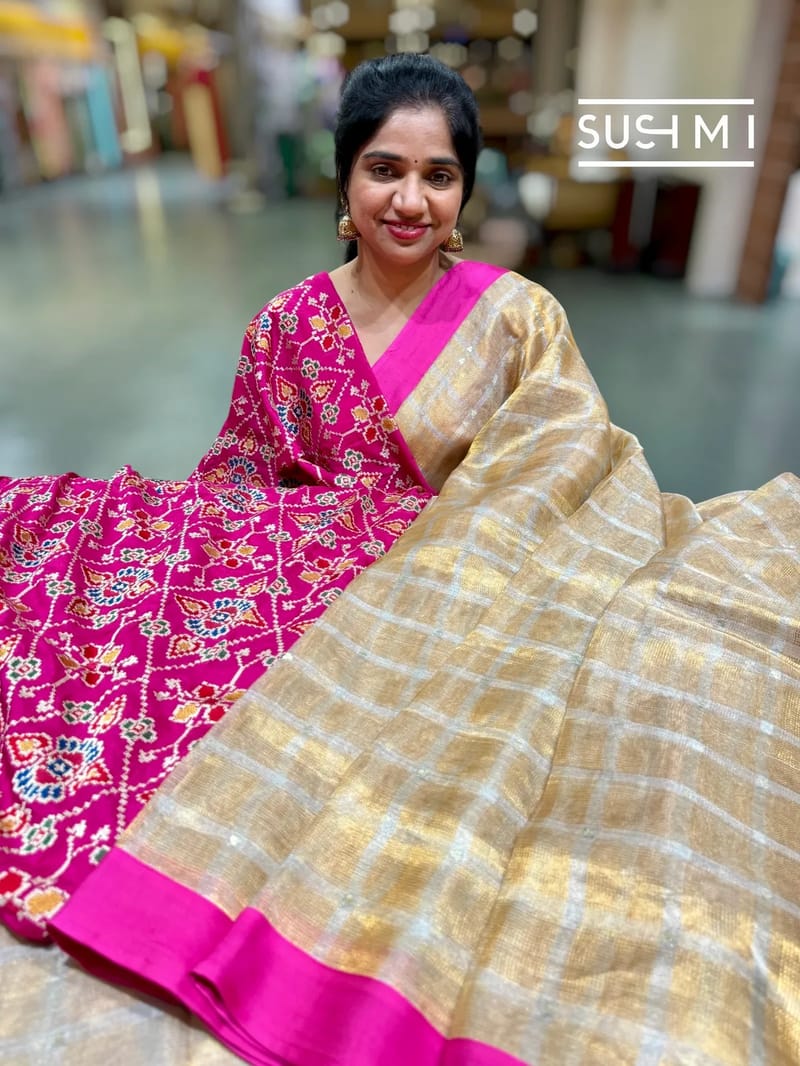 Gold Banarasi Tissue checks saree with pink fusion embroidered blouse 