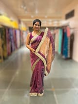 Wine Pure handloom Banarasi Tissue saree hemlined with Sabhyasachi style fringe laces .