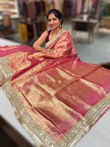 Pink Pure handloom Banarasi Tissue saree hemlined with Sabhyasachi style fringe laces .SS50431