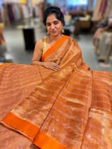 Orange Tissue saree with kanchi silk embroidered blouse