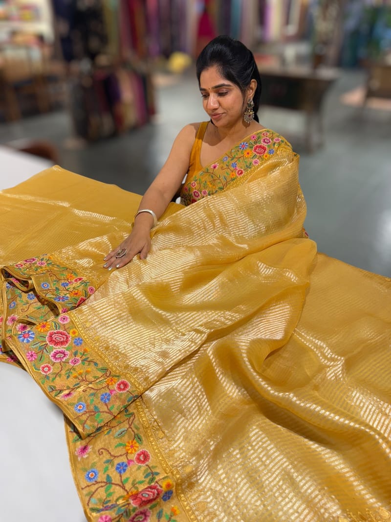 Mango yellow Tissue Stripes Saree with petite point Embroidered tissue border and blouse .