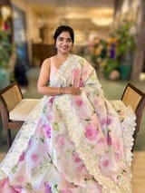Ivory Printed Organza Saree With Chantilly Lace Style Embroidered Border.