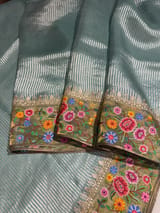 Dusty Blue Tissue Stripes Saree with petite point Embroidered tissue border and blouse .
