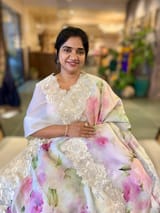 Ivory Printed Organza Saree With Chantilly Lace Style Embroidered Border.