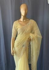 Pastel yellow organza handwork saree