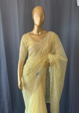 Pastel yellow organza handwork saree