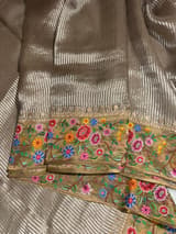Earthy Tone Tissue Stripes Saree with petite point Embroidered tissue border and blouse .