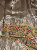 Earthy Tone Tissue Stripes Saree with petite point Embroidered tissue border and blouse .