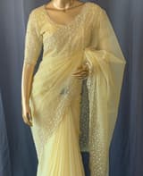 Pastel yellow organza handwork saree