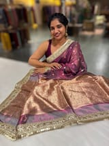 Wine Pure handloom Banarasi Tissue saree hemlined with Sabhyasachi style fringe laces .