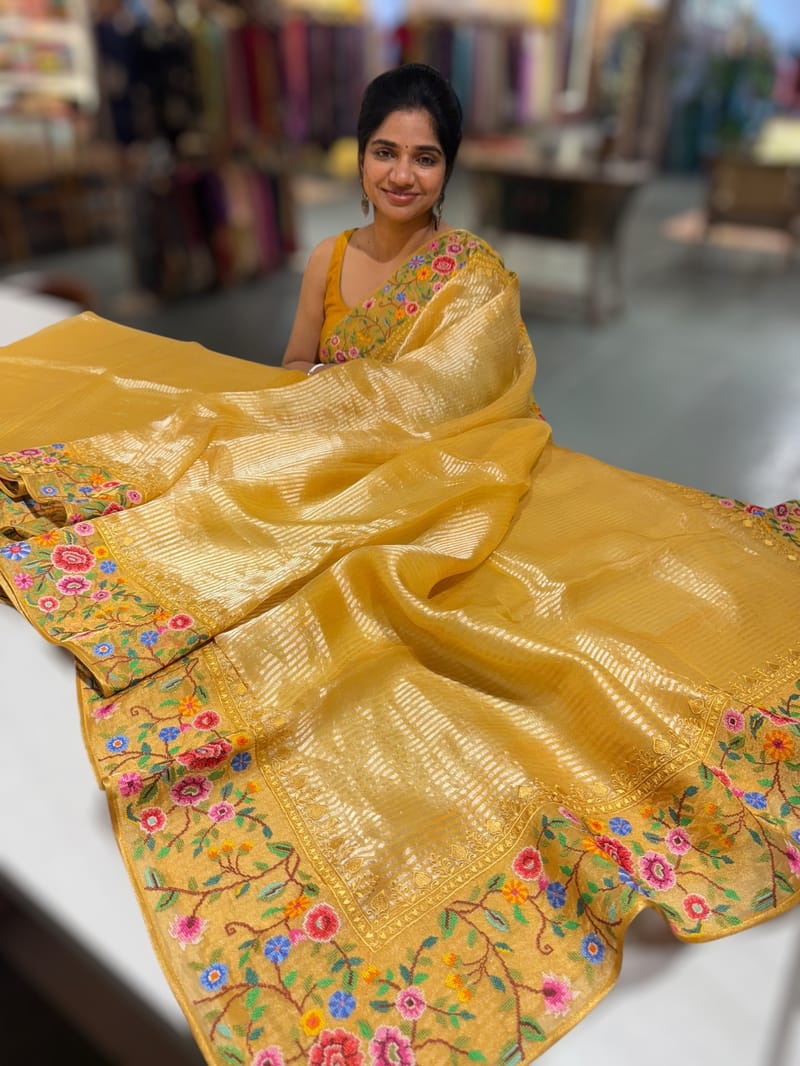 Mango yellow Tissue Stripes Saree with petite point Embroidered tissue border and blouse .